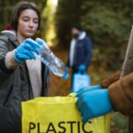 person collecting plastic to recycle