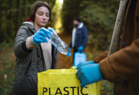 person collecting plastic to recycle
