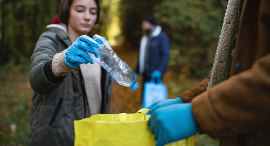 person collecting plastic to recycle
