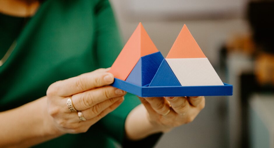 person holding pyramids