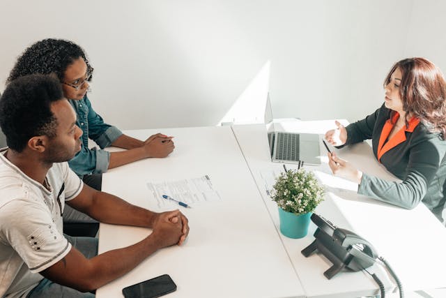 a couple of people consulting a specialist