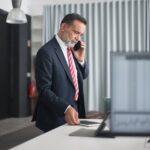 man-wearing-black-suit-in-the-office