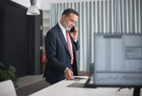 man-wearing-black-suit-in-the-office