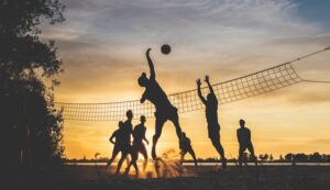 silhouette-of-people-playing-basketball-during-sunset